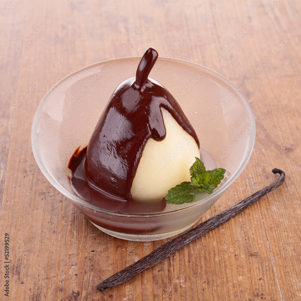 Wall mural pear with chocolate sauce