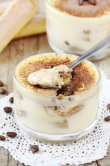 Delicious Italian dessert Tiramisu in a glass bowl