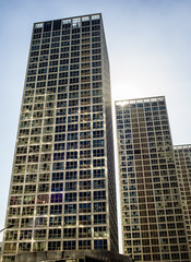 Fototapeta na wymiar Office buildings against sunshine