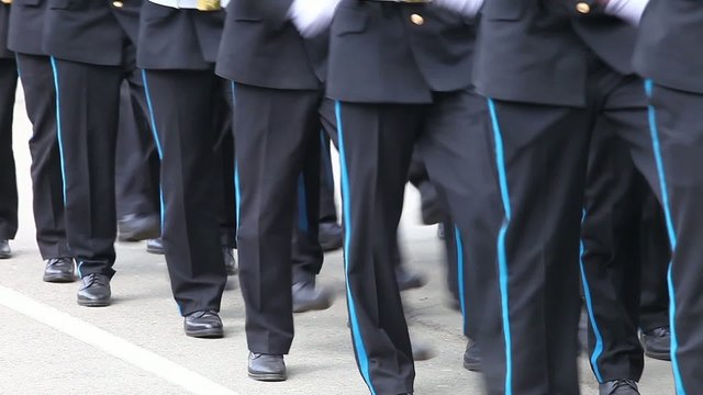 Formation of soldiers in dress parade uniform.