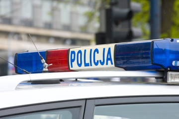 Polish police sign on a door of police car