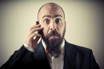  funny elegant bearded man on the phone