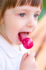Little girl with lollipop