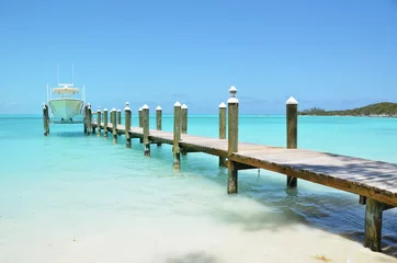 Fotobehang Yacht at the wooden jetty. Exuma, Bahamas © HappyAlex