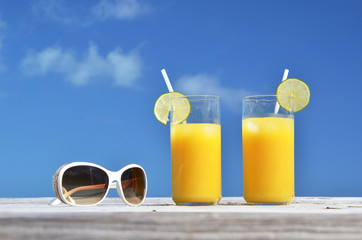 Sunglasses and orange juice