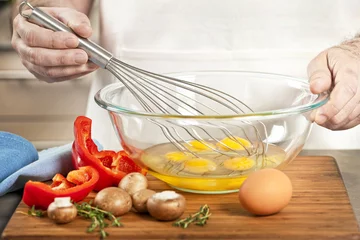 Fotobehang Eieren Whisking eggs in bowl  © Elenathewise