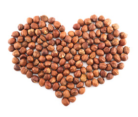 Heart shape made of hazelnuts isolated