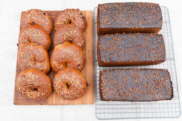 Whole grain bagels with sesame seeds and rye bread with coriande