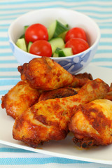 Roasted chicken drumsticks with green salad