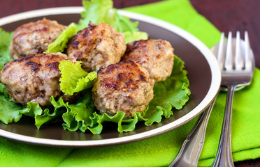 Meatballs on salad leaves