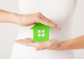 woman hands holding green house