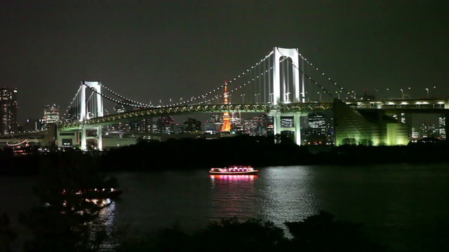 The Rainbow Bridge is a suspension bridge crossing northern Tokyo Bay. Night view with lights