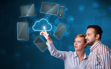 Happy couple touching cloud service