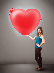 Young lady holding lovely 3d red heart