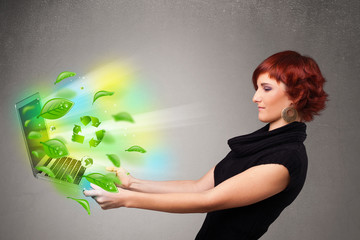 Casual woman holding notebook with recycle and environmental sym