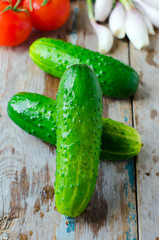 Fresh cucumbers on a wooden table
