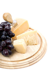cheese and grapes on a white background