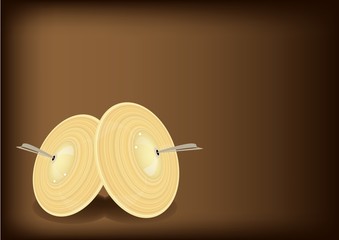 A Beautiful Cymbal on Dark Brown Background