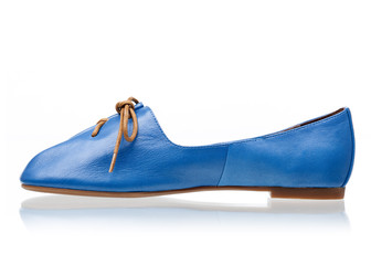 Blue female shoe over white background