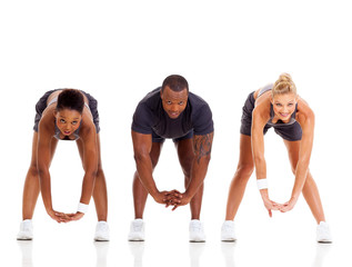 Obraz premium group of three people stretching