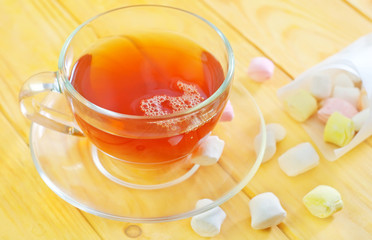 Fresh tea with candy