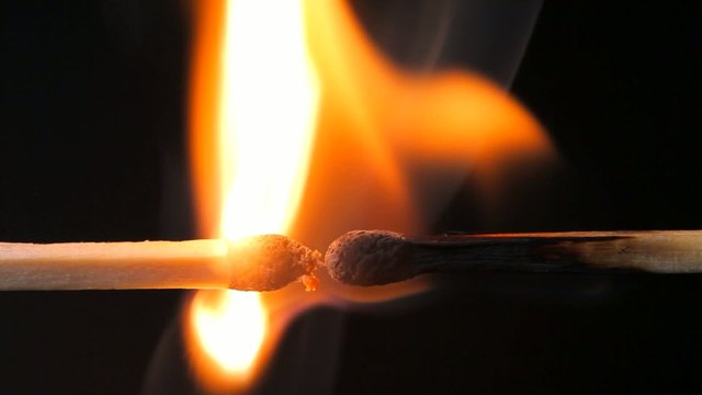A matchstick lights ignition