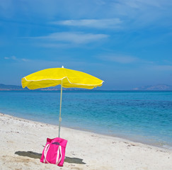 bag and umbrella at the beach
