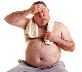 Overweight man resting, tired after training, with hand on foreh - obrazy, fototapety, plakaty