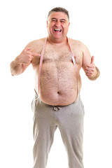 Happy fat man with a tape measure around his neck