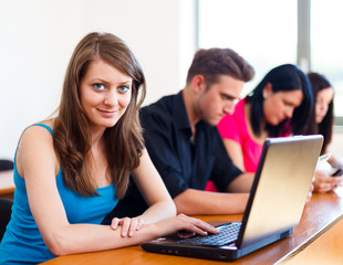 Beautiful Girl With Laptop In School