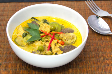 Green Curry with Chicken in a white bowl