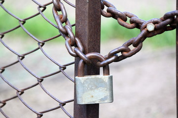 Lock on a chain link security fence.