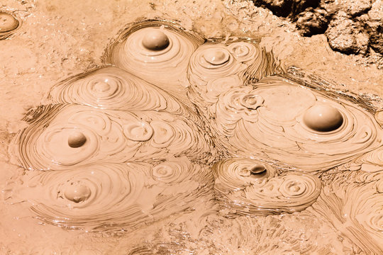 Bubbling hot mud geothermal spring background