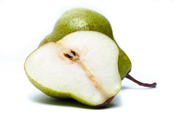 A pear with a slice isolated on white