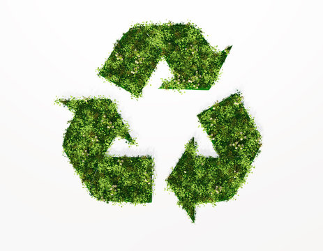 recycling symbol covered by grass and flowers