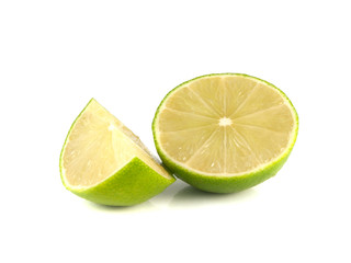 Isolated green lime with slice on white