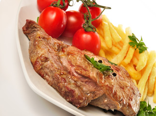 Chuleta con patatas.
