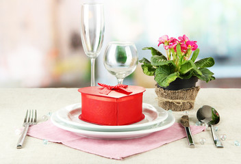 Romantic table serving on bright background