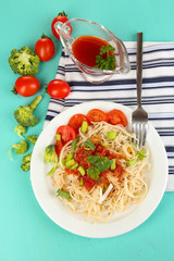 Tasty spaghetti with sauce and vegetables