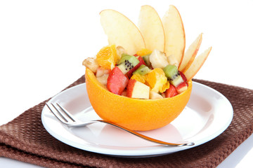Naklejka na ściany i meble Fruit salad in hollowed-out orange isolated on white