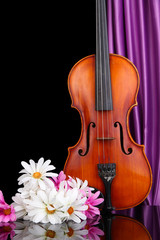 Fototapeta na wymiar Classical violin on curtain background