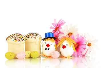 Easter eggs and two chicken toys isolated on white
