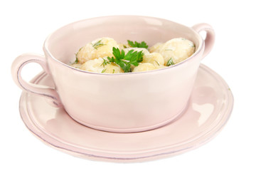 Tender young potatoes with sour cream and herbs in pan isolated