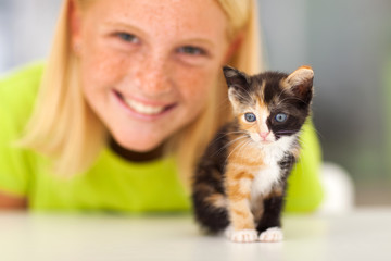 cute little kitten and teen girl