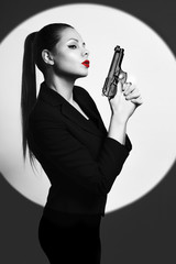 sexy detective woman holding aiming gun