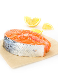 Piece of fresh salmon steak on a white background