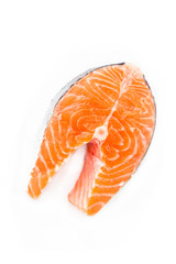 Piece of fresh salmon steak on a white background