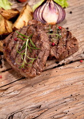 Grilled steaks on wood 