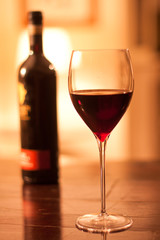 Glass of Red Wine with Bottle