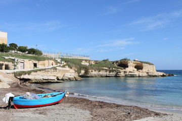 Fototapeta na wymiar boat and beach in Salento Peninsular of Apulia, Italy
